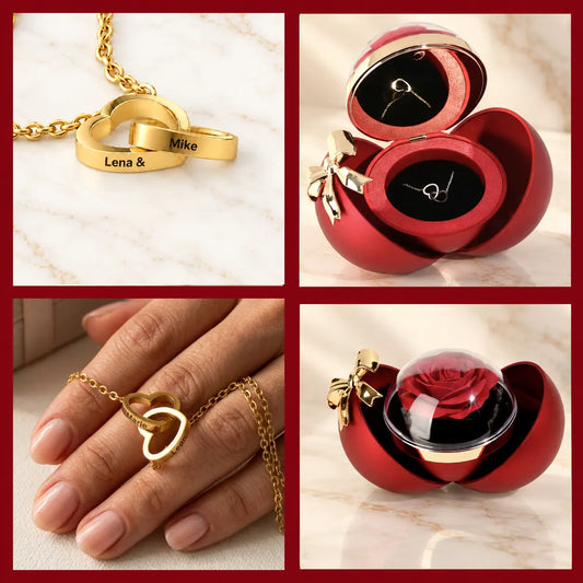 Goldene Doppelherzkette mit Gravur Marie und Leon, geöffnete rote Kugelbox mit Kette und Box mit roter Rose