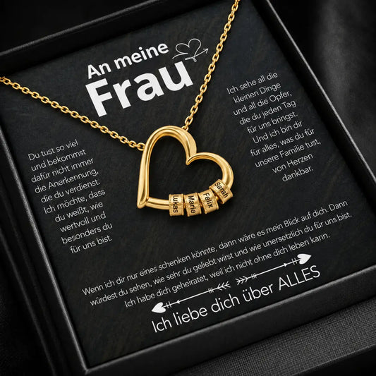 Gelbgold-Herzkette mit gravierten Beads auf der Karte An meine Frau in schwarzer Premium-Box