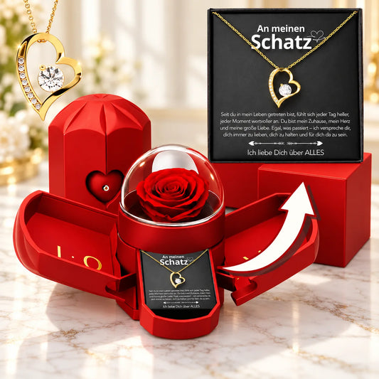 Gelbgold-Herzanhänger mit ewiger Rose in roter Geschenkbox und Karte An meinen Schatz auf hellem Marmor